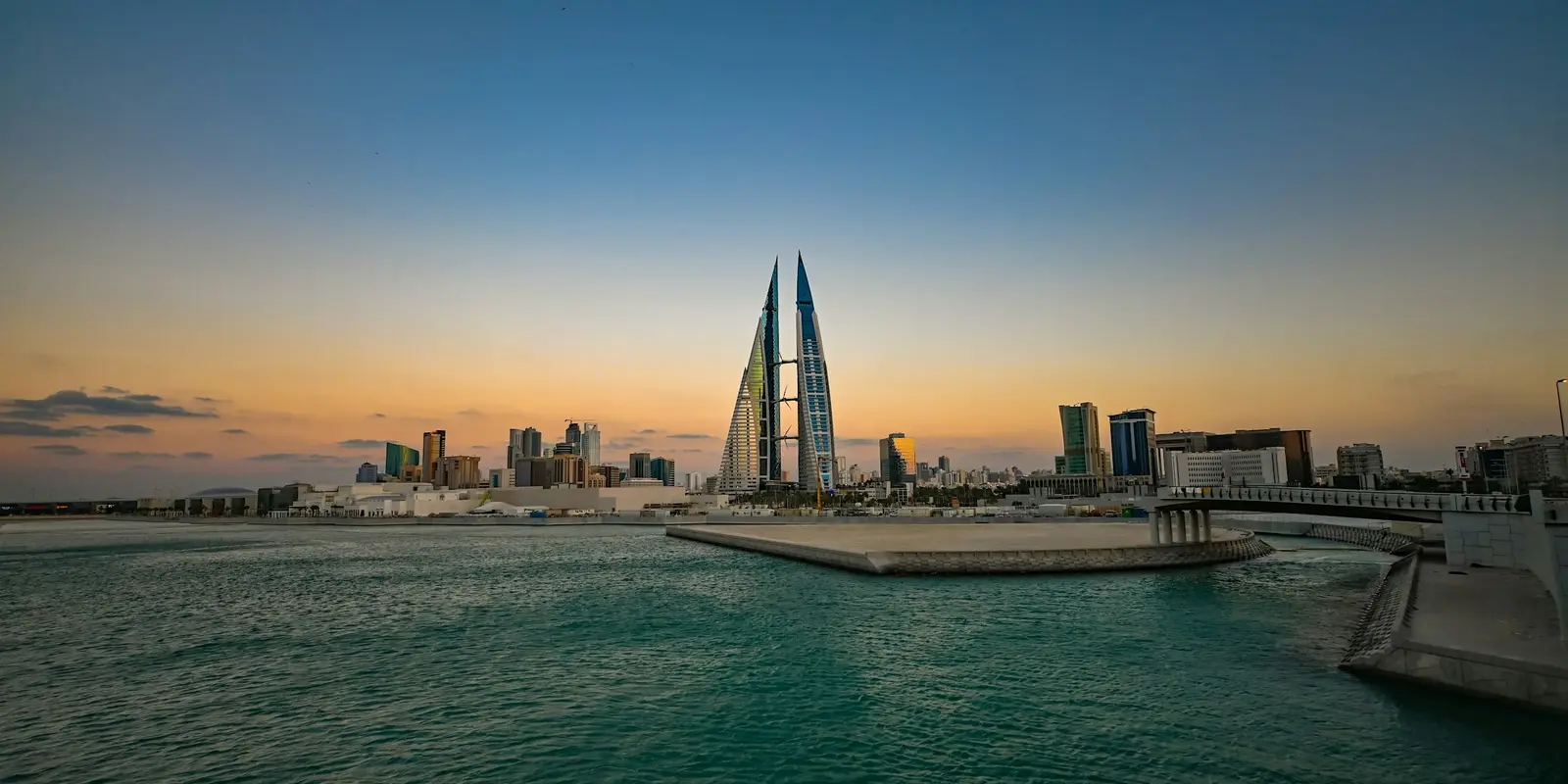 Manama skyline at sunset along the waterfront in Bahrain