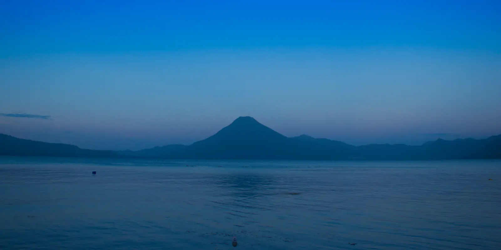 A traveler looking across Guatemala's volcanic highlands