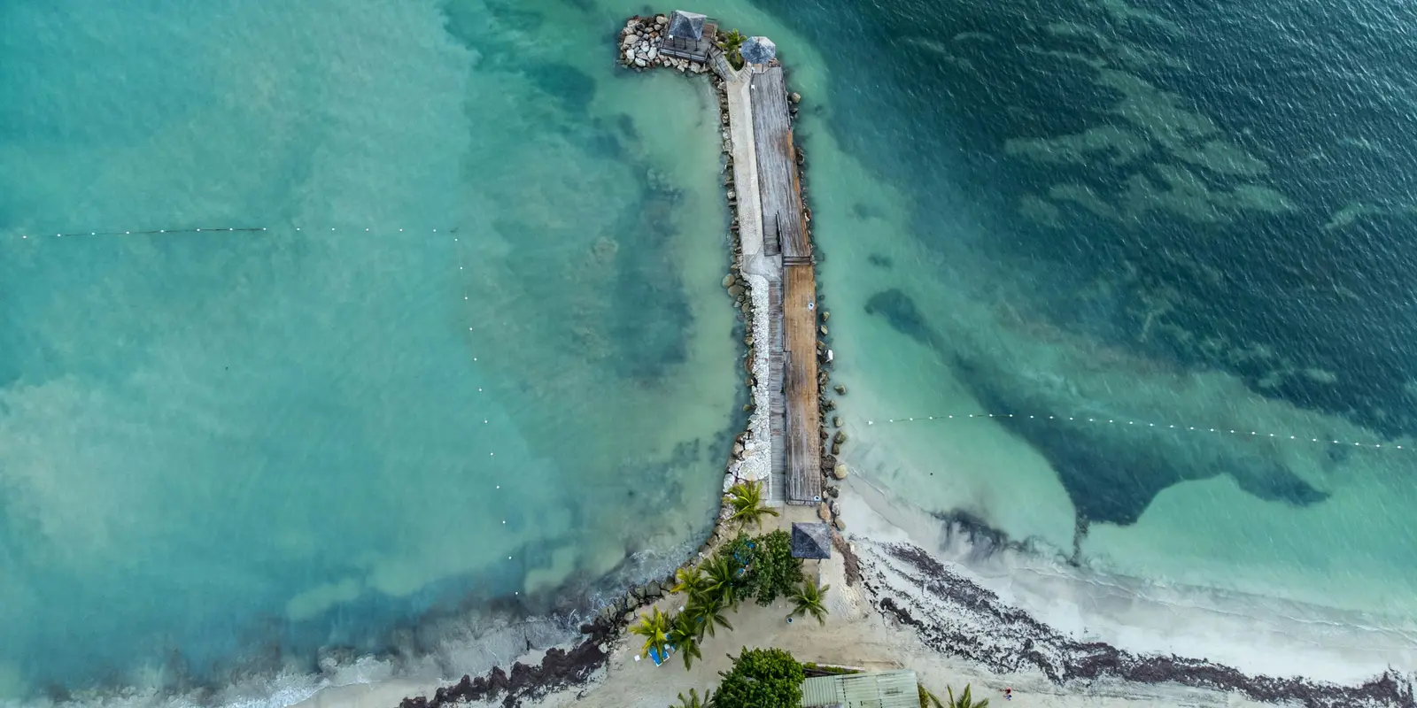 Aerial view of Montego Bay's coastline and buildings along the water in Jamaica