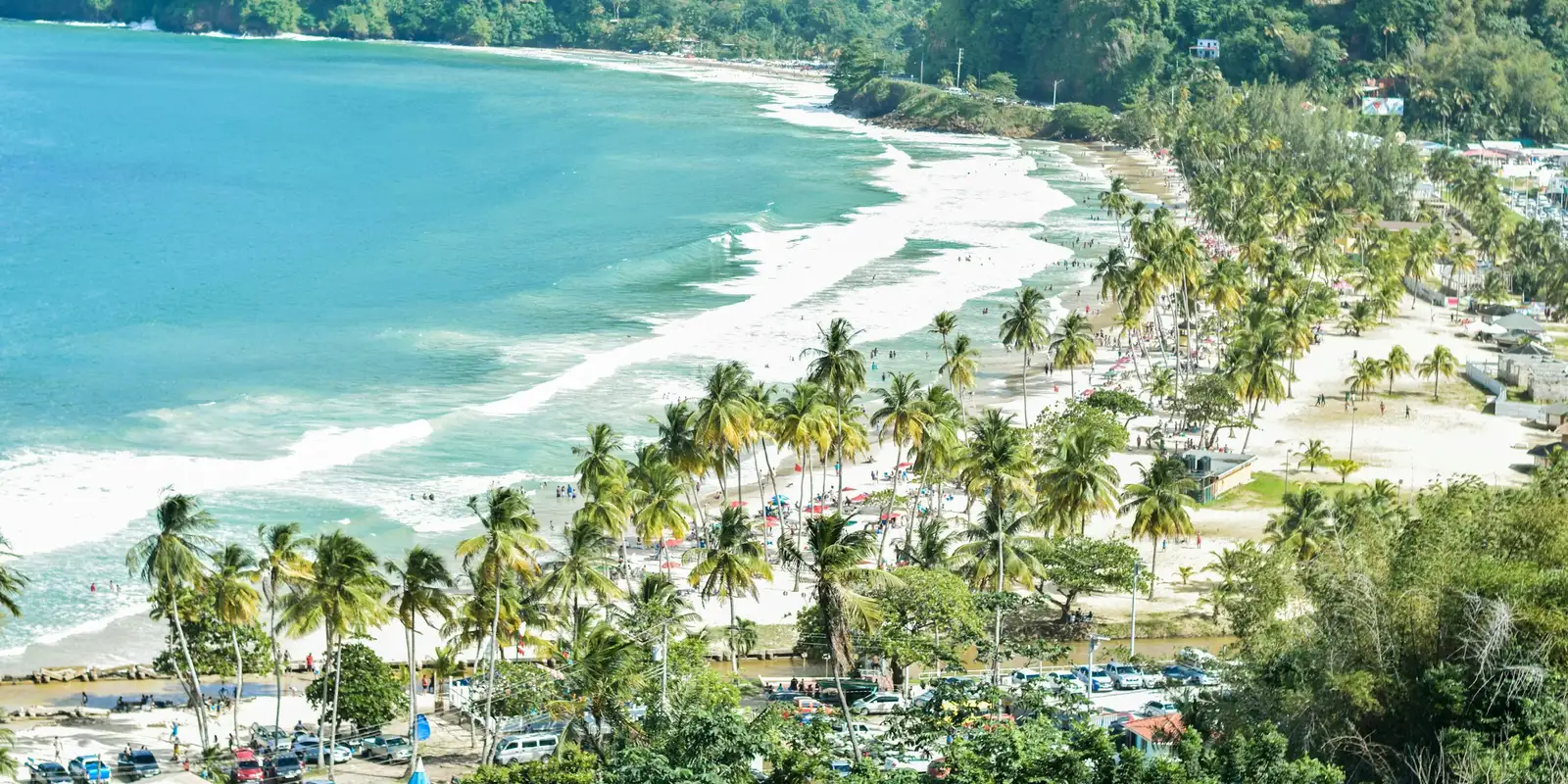 Tobago's coastline, where the same Digicel-based eSIM keeps working after the ferry from Trinidad A quiet beach on Tobago with green trees along the white sand