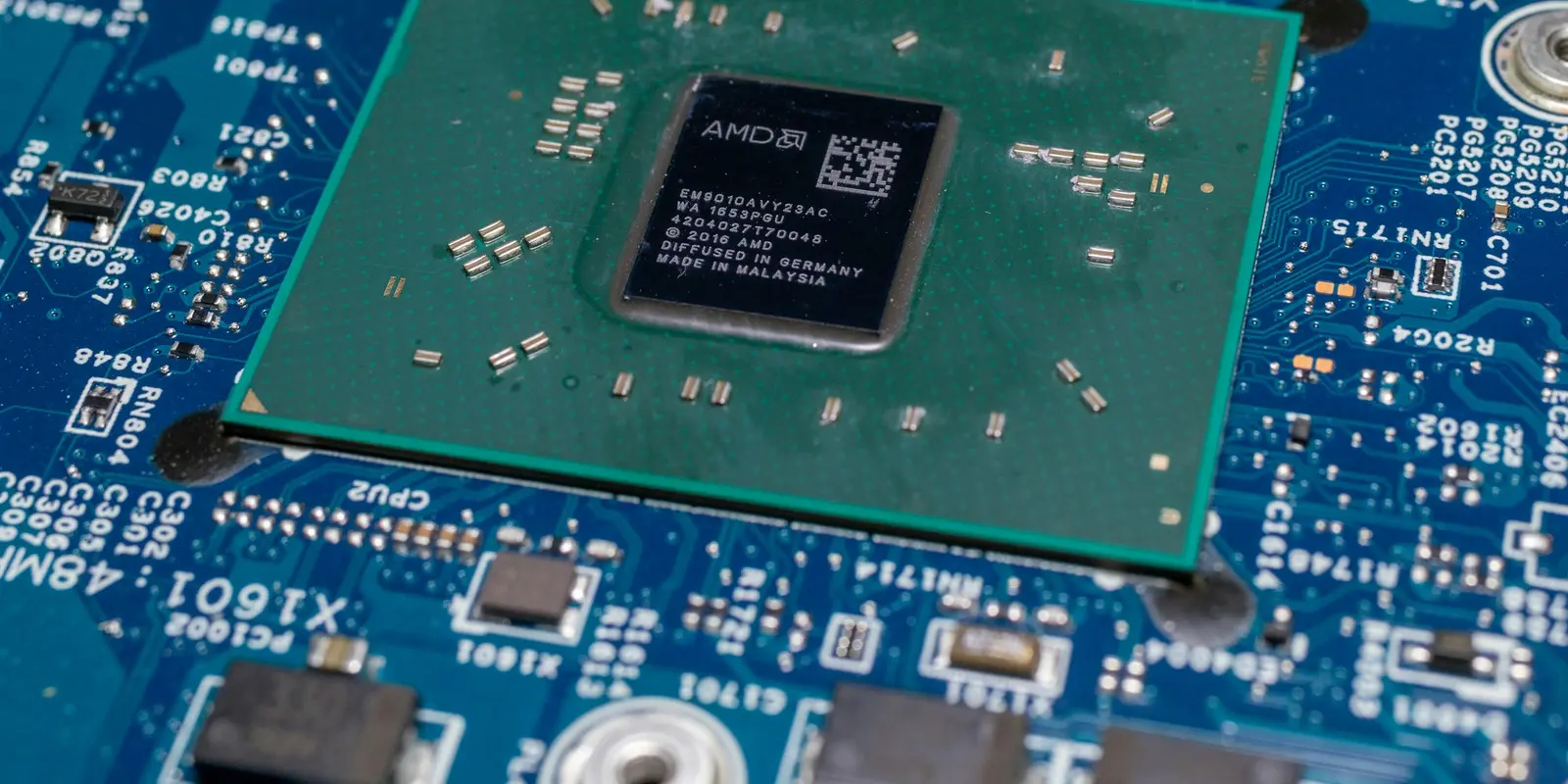 An iSIM lives inside this same processor chip instead of on a separate soldered component nearby Close-up of a smartphone's internal circuit board and processor