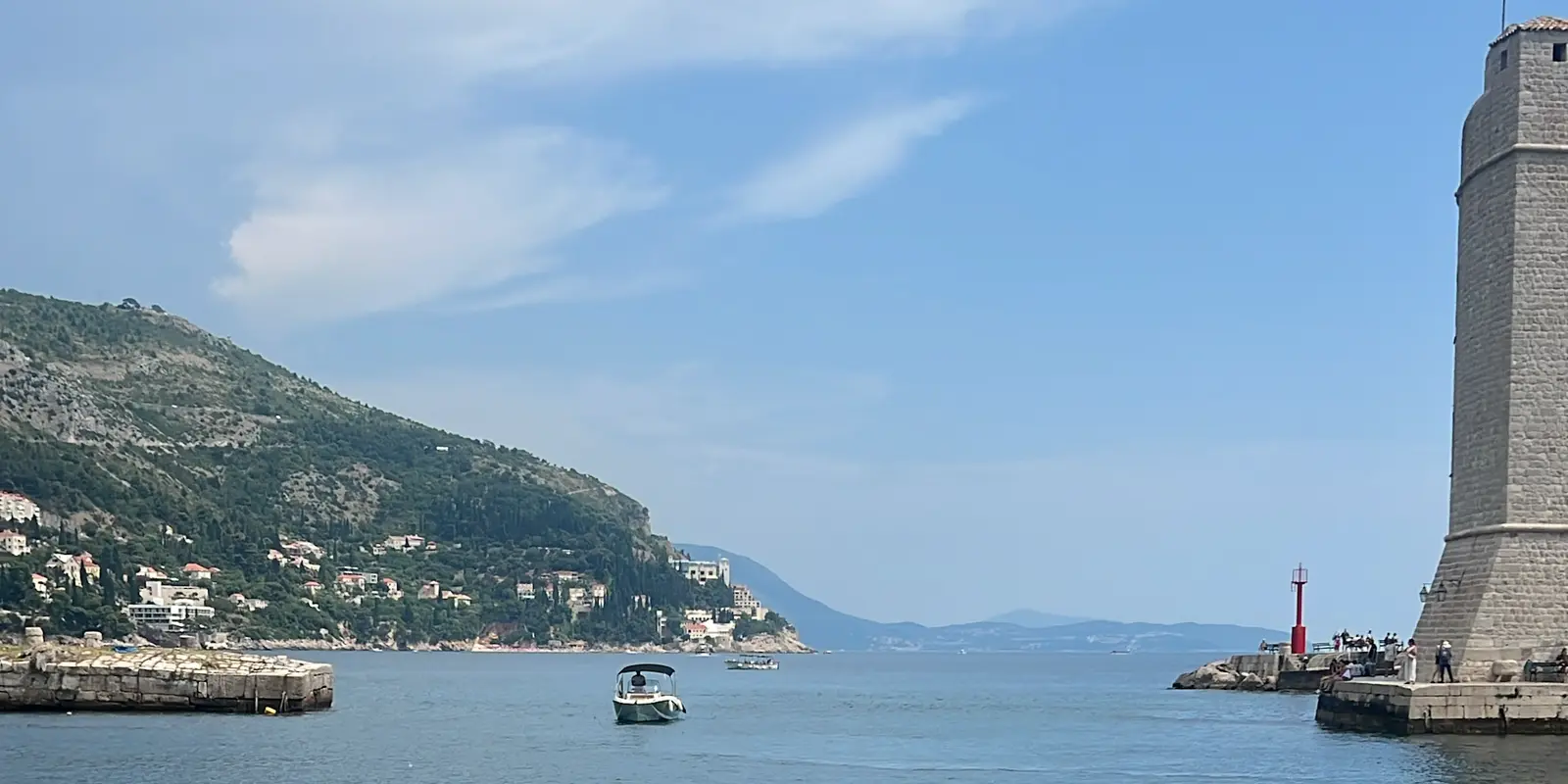 A boat moored at a Croatian harbor entrance on the Adriatic coast