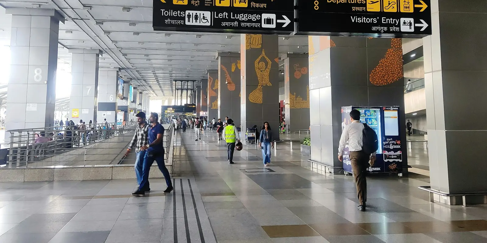Arrivals hall at an Indian international airport, where tourists first hit the SIM KYC counter and OTP-gated Wi-Fi login