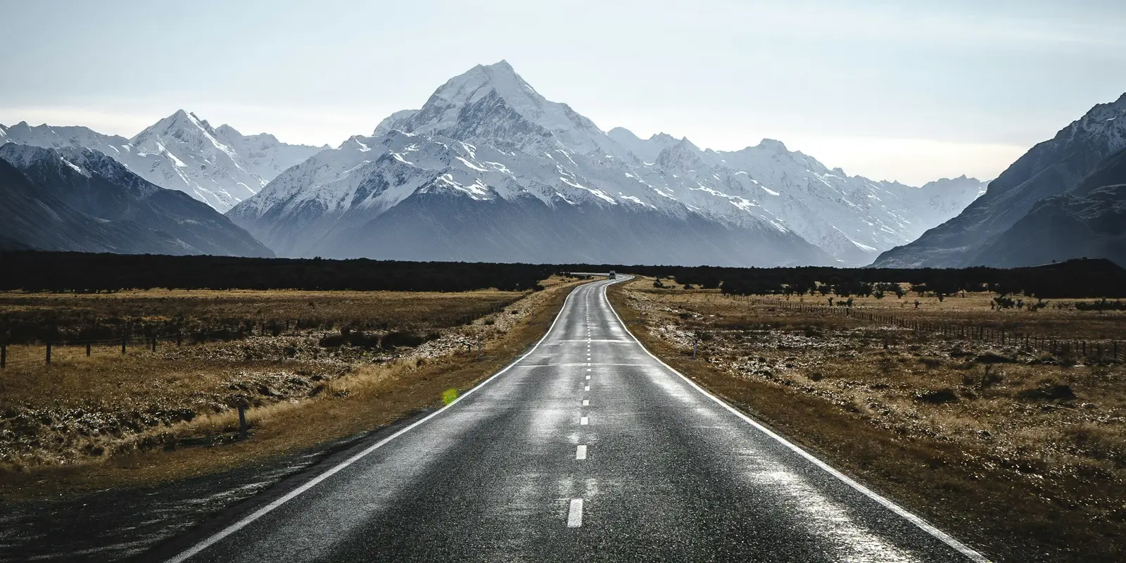 The approach to Aoraki/Mount Cook — coverage thins out identically across all three networks here Empty road toward the mountains near Aoraki/Mount Cook, New Zealand