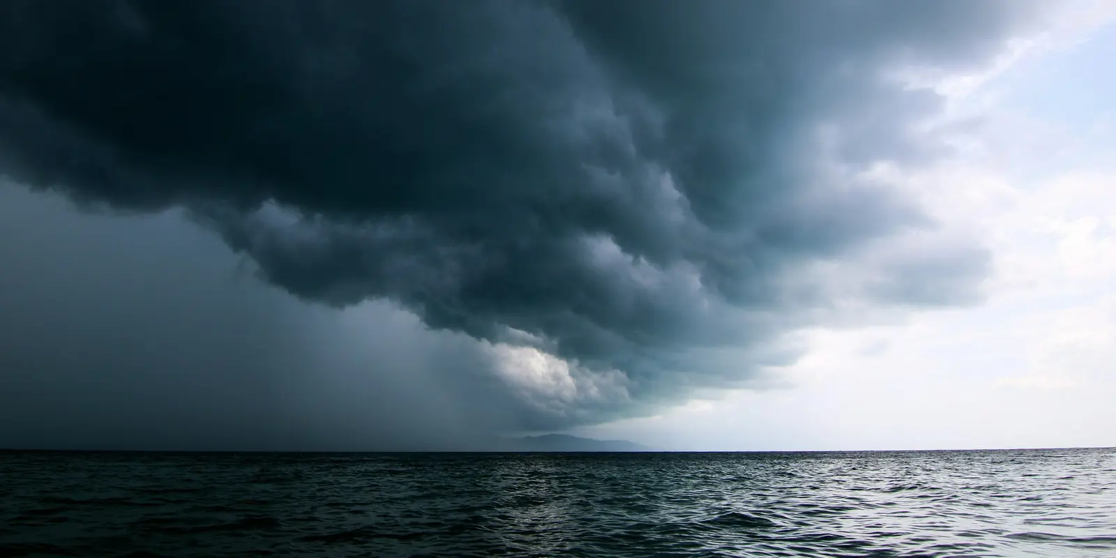 The Philippines' typhoon season runs June through November and peaks July to October, according to PAGASA A large storm system moving across the sky over open ocean water, the kind of weather system that regularly crosses the Philippine Area of Responsibility between June and November