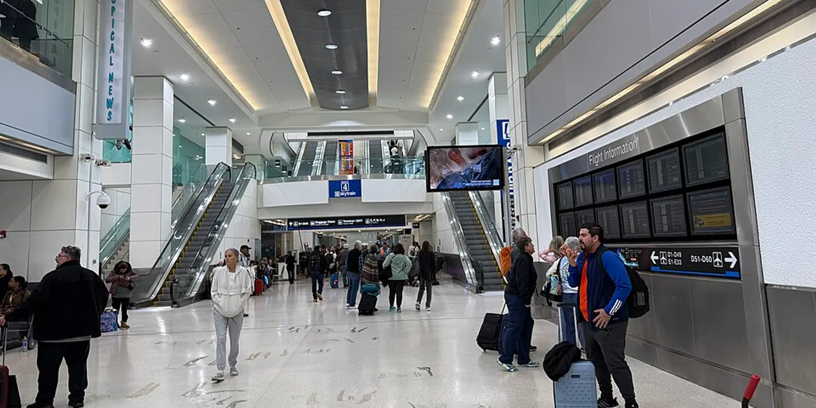 Passengers inside Miami International Airport Terminal D