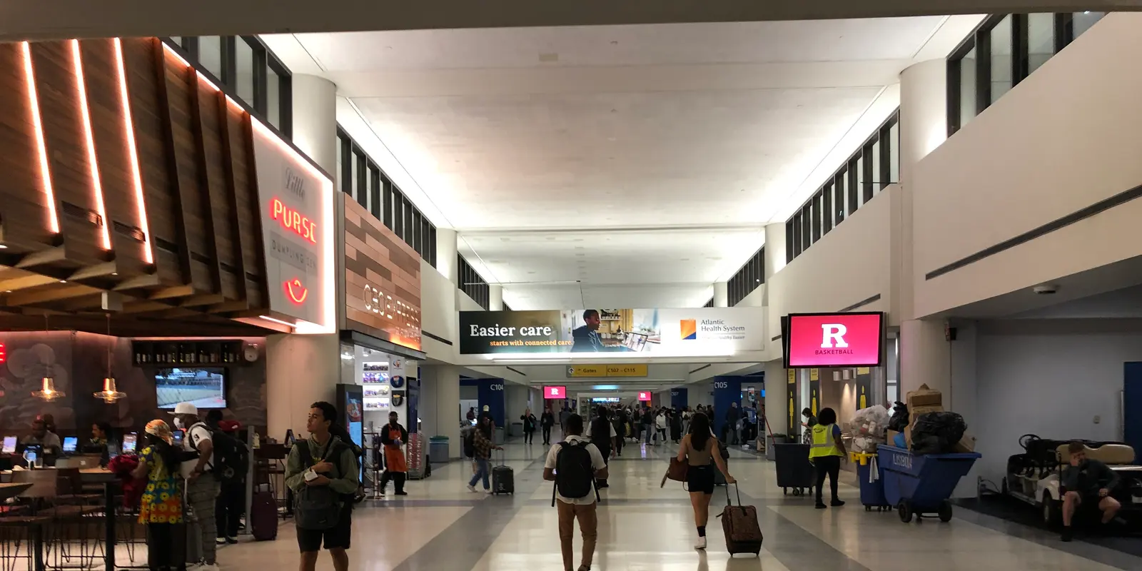 Travelers in the Terminal C concourse at Newark Liberty International Airport
