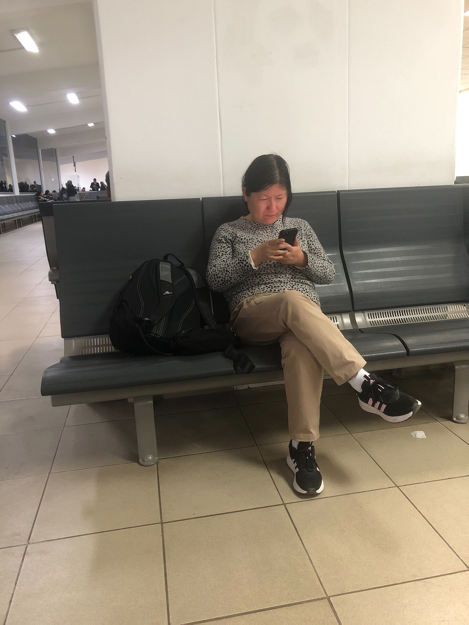 Traveler using a smartphone before choosing a mobile data line