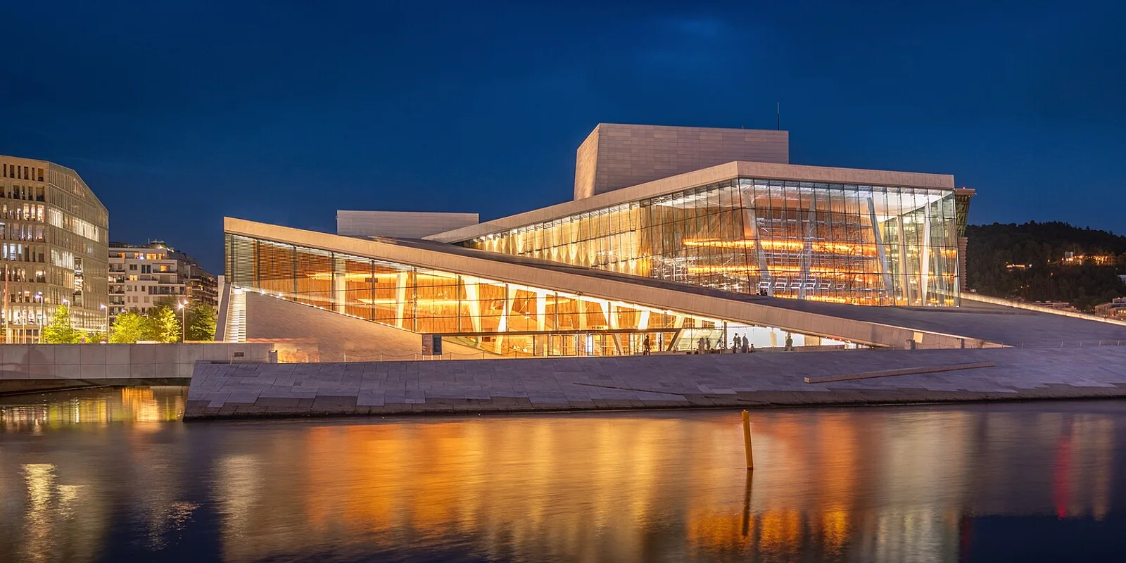 Photo: Pierre Blaché · CC0 · cropped and resized Oslo Opera House reflected in the waterfront at dusk